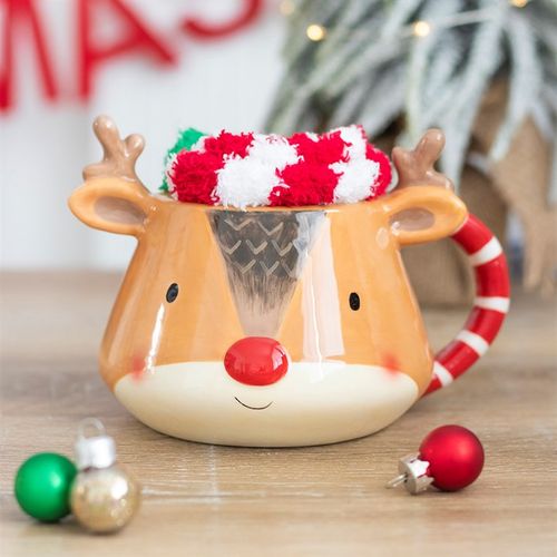 Cozy up with the Reindeer Mug and Socks Set, featuring a cute mug and fluffy red and white striped socks for Christmas.