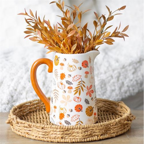 Add autumn charm to your decor with the 17cm Autumn Leaves and Pumpkins Ceramic Flower Jug, featuring vibrant designs and an orange handle.