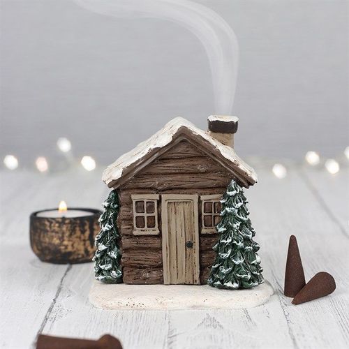 Charming Log Cabin Incense Cone Burner with smoke emerging from the chimney, perfect for cosy winter nights.