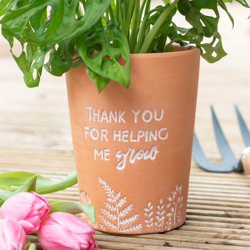 Stylish Thank You For Helping Me Grow Terracotta Plant Pot with vibrant greenery and pink tulips, perfect for any home.