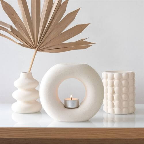 Cream Speckle Single Stem Vase in a modern design, perfect for showcasing fresh or dried flowers. Stylish and unique.