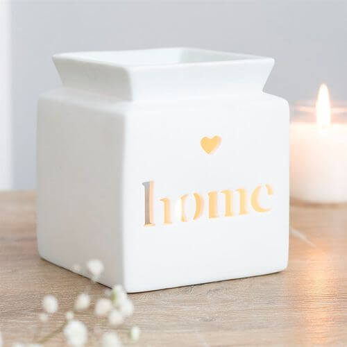 White Home Cut Out Oil Burner in white ceramic, featuring a heart cutout and 'home' text for calming fragrances.