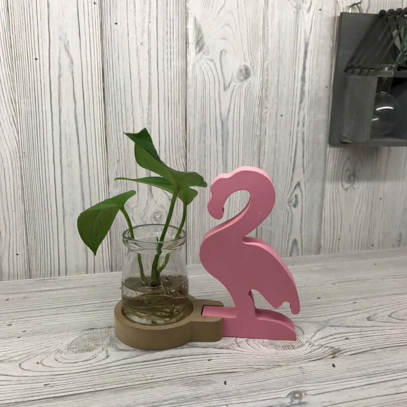 Hydroponic Home Décor - Pink Flamingo Pot showcasing a vibrant plant in a stylish frame, perfect for any space.