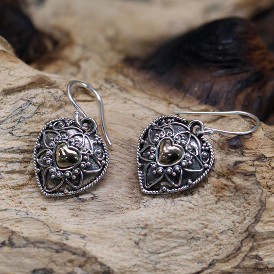 Elegant Silver & 18ct Gold Mandala Hearts earrings, featuring intricate designs and a stylish hook fitting.