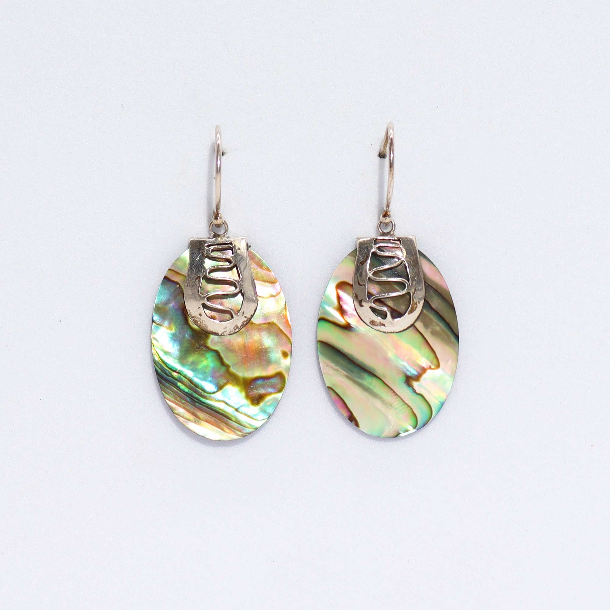 Stunning Shell & Silver Earrings featuring iridescent abalone, handcrafted with care in Bali for a unique accessory.