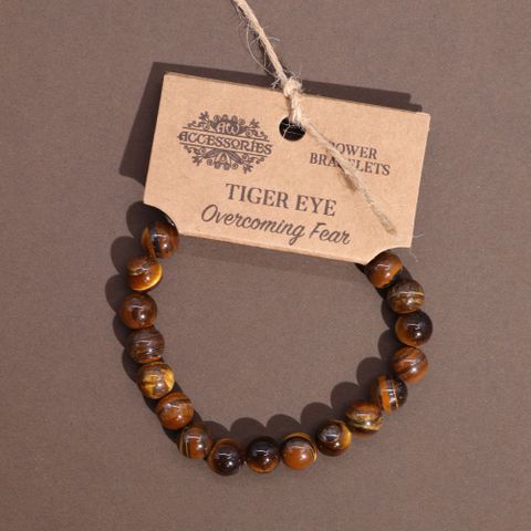 Power Bracelet - Tiger Eye featuring elegant beads, perfect for enhancing any outfit with harmony and balance.