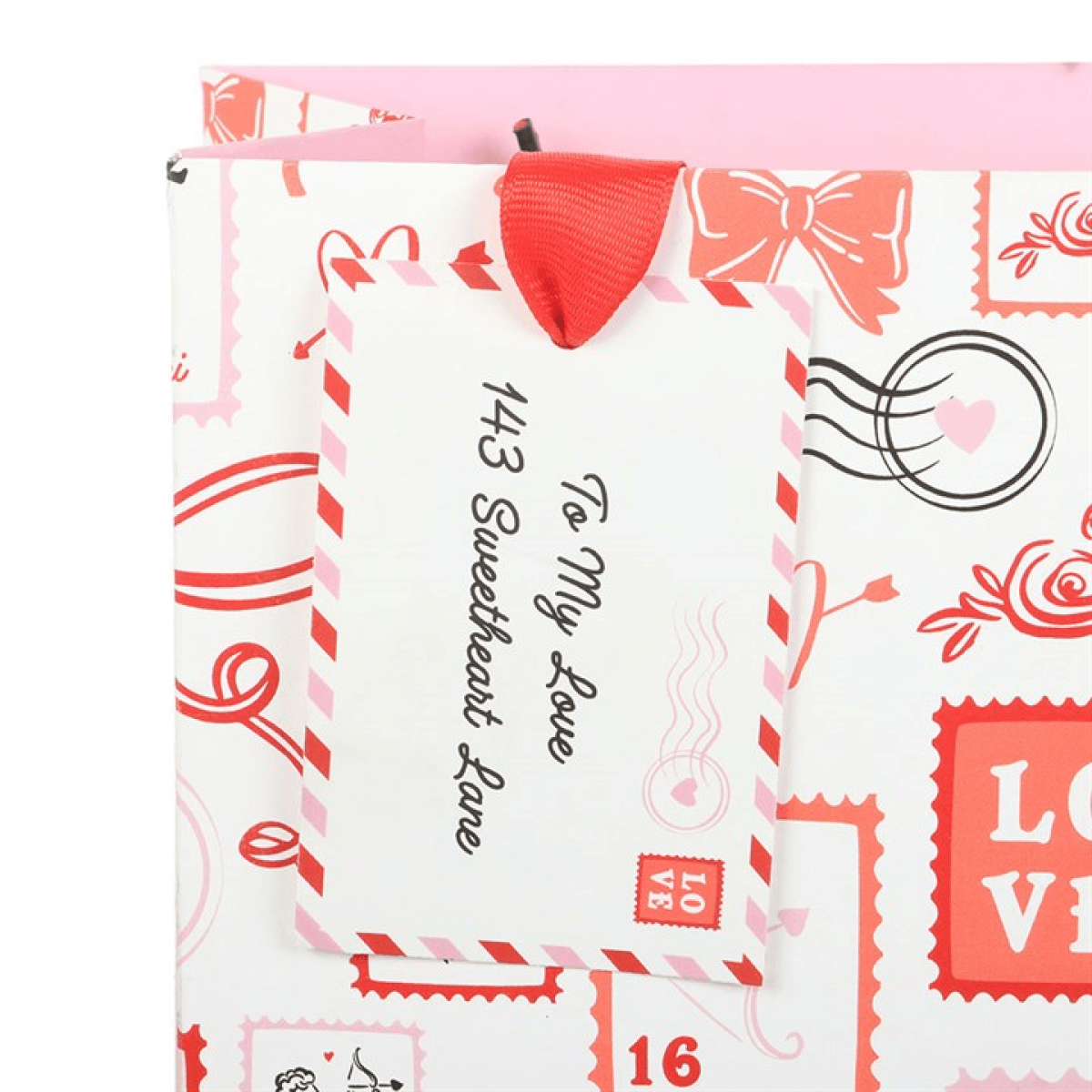 Valentine postage stamp gift bag with tag saying 'To My Love 143 Sweetheart Lane' and decorative stamp print.
