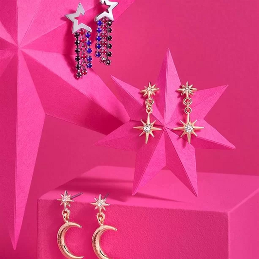 Stylish Avon Juliet Earring set displayed on vibrant pink stars, featuring three elegant and unique designs for versatility.