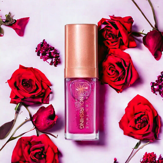 Avon True Nourishing Lip Oil "Blossom" in a floral setting, offering hydration and shimmer for beautiful lips.