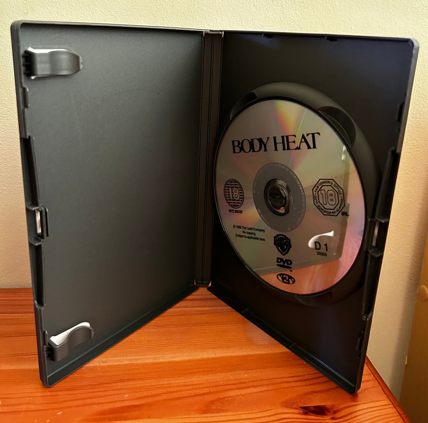 Body Heat [DVD] [1981] displayed in case, a classic film showcasing passion and betrayal, perfect for collectors.