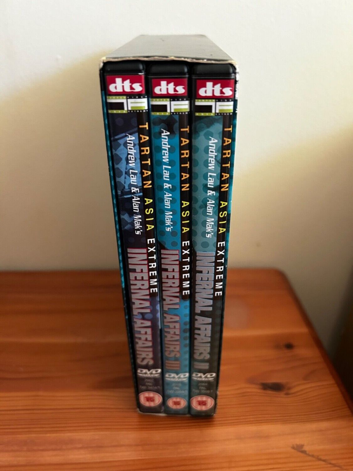 Infernal Affairs - The Trilogy (DVD, 2005) showcases all three films in this critically acclaimed thriller set.