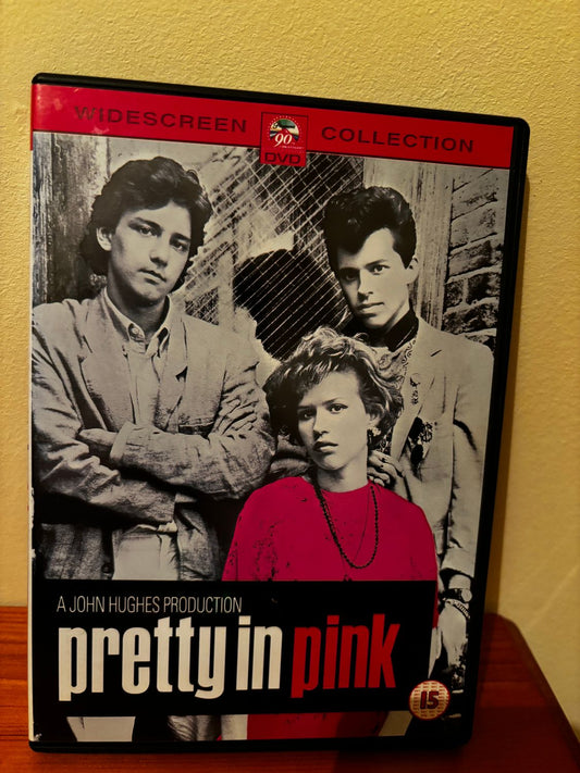 Pretty In Pink (DVD) showcases the iconic 1980s film with Molly Ringwald in a vibrant pre-loved edition.