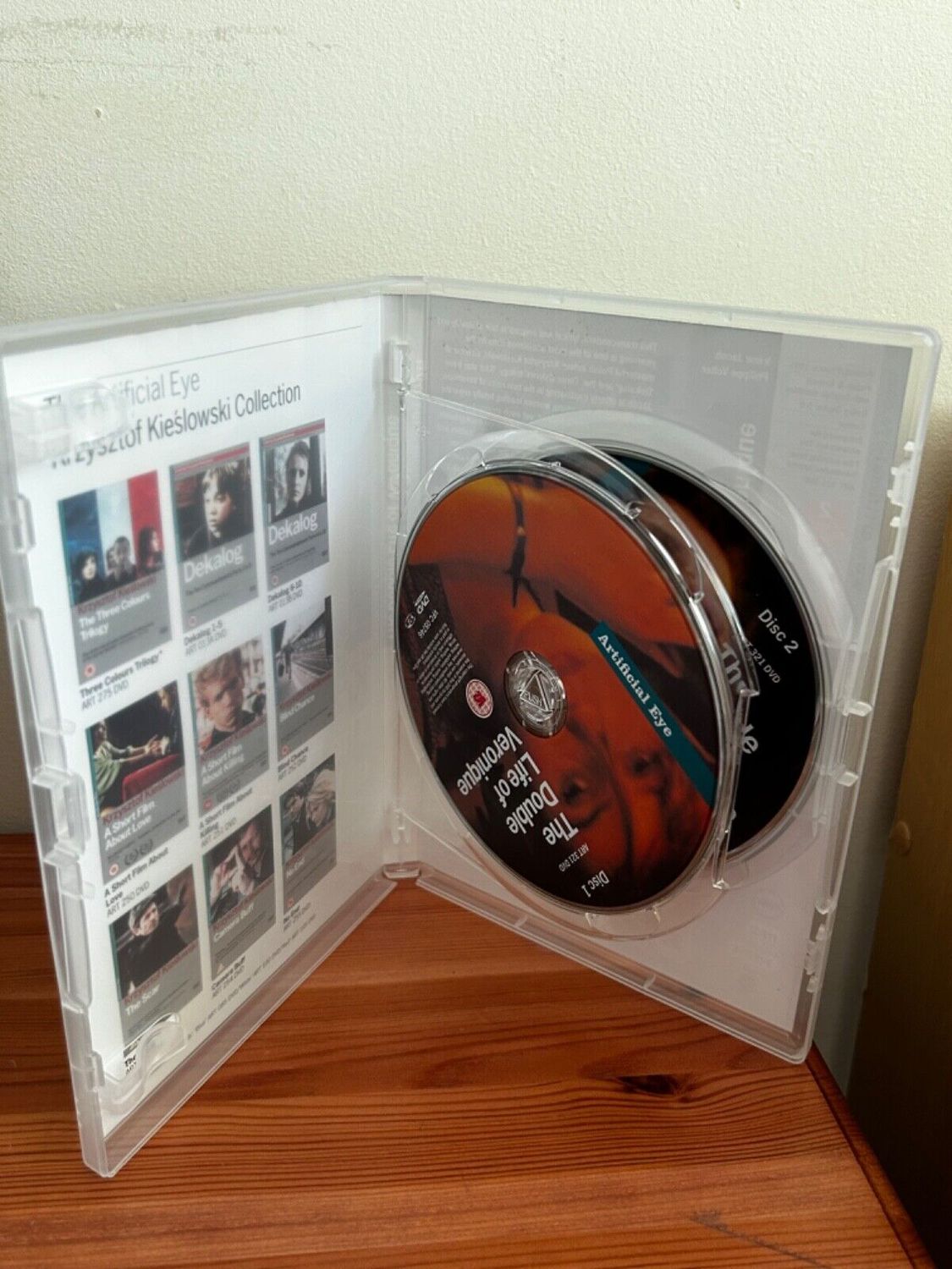 Explore The Double Life Of Veronique [DVD] two-disc collection featuring captivating artwork and Kieslowski's brilliance.