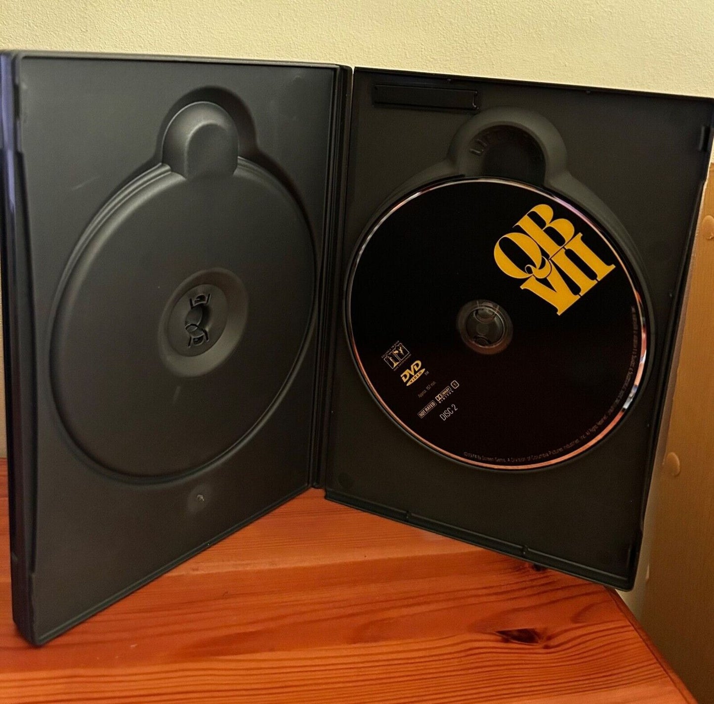 QB VII [DVD] displayed in its case, showcasing the gripping drama directed by Tom Gries. Available now.