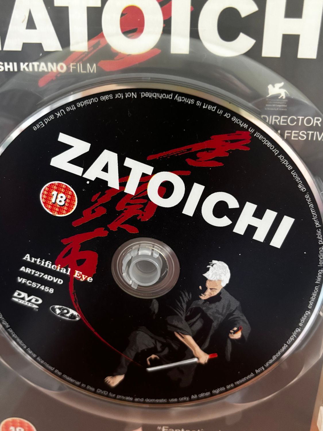 Zatoichi (DVD) Artificial Eye features the captivating disc design showcasing Takeshi Kitano's iconic film.