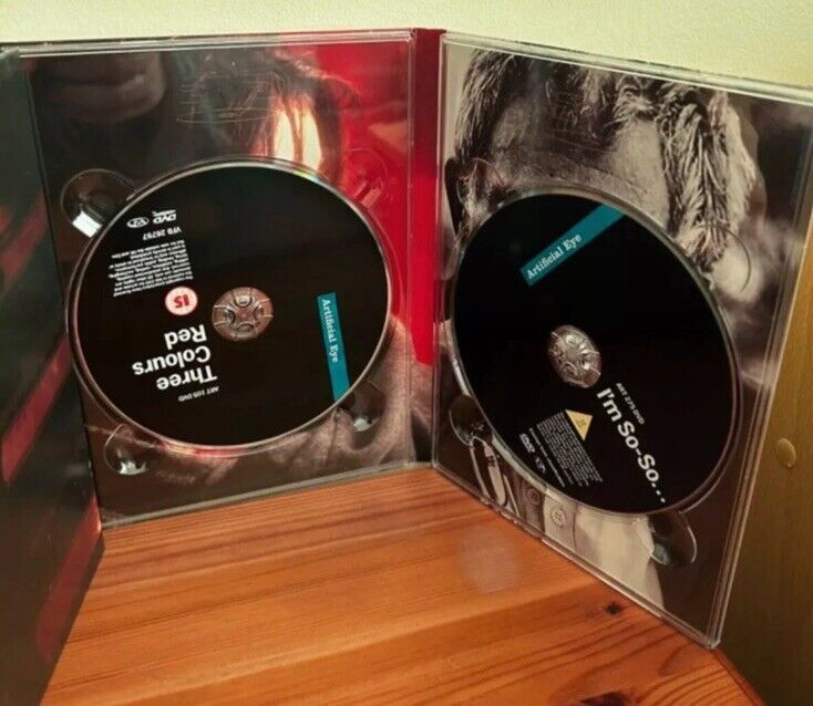 Inside view of the Three Colours Trilogy (Box Set) (DVD) showcasing the discs and artwork for an immersive cinematic experience.
