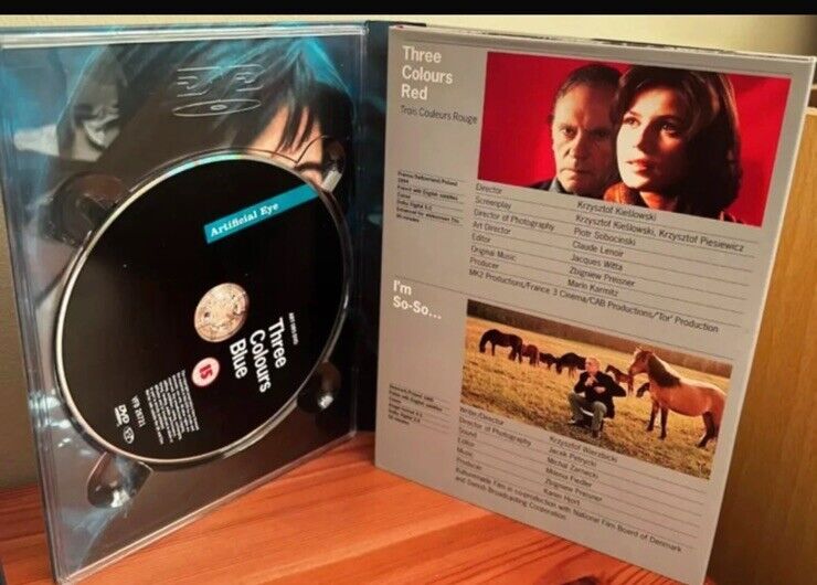 Three Colours Trilogy (Box Set) (DVD) showcasing discs and details from Kieslowski's cinematic masterpiece.