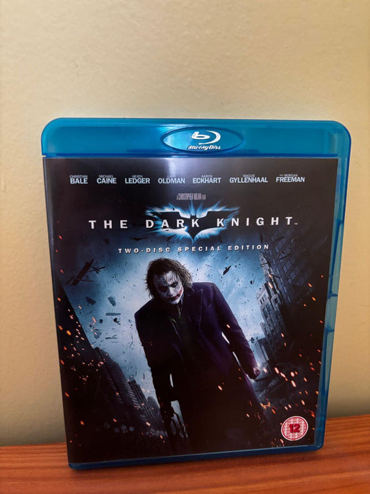 The Dark Knight Blu Ray showcases the iconic Joker on its striking cover, perfect for any film enthusiast.