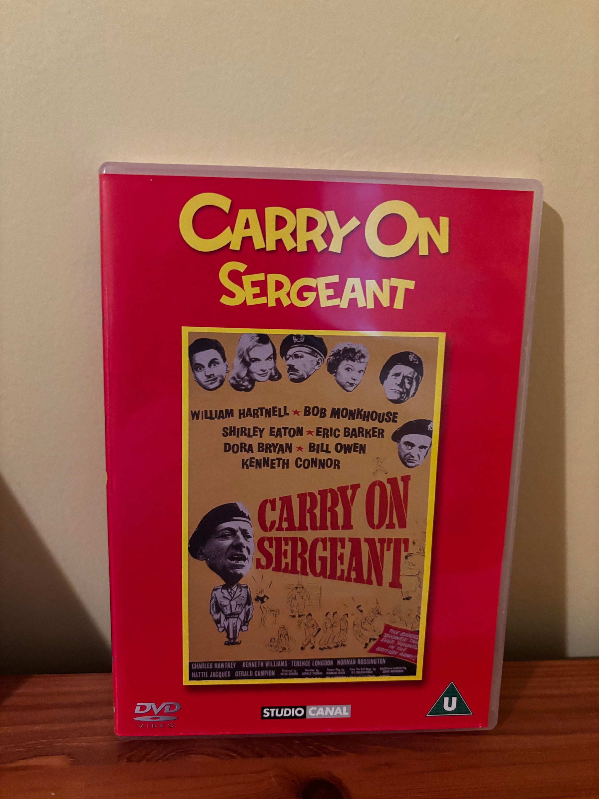 Carry On Films (Various) Please Choose From Dropdown showcases classic British comedy on this vibrant DVD cover.