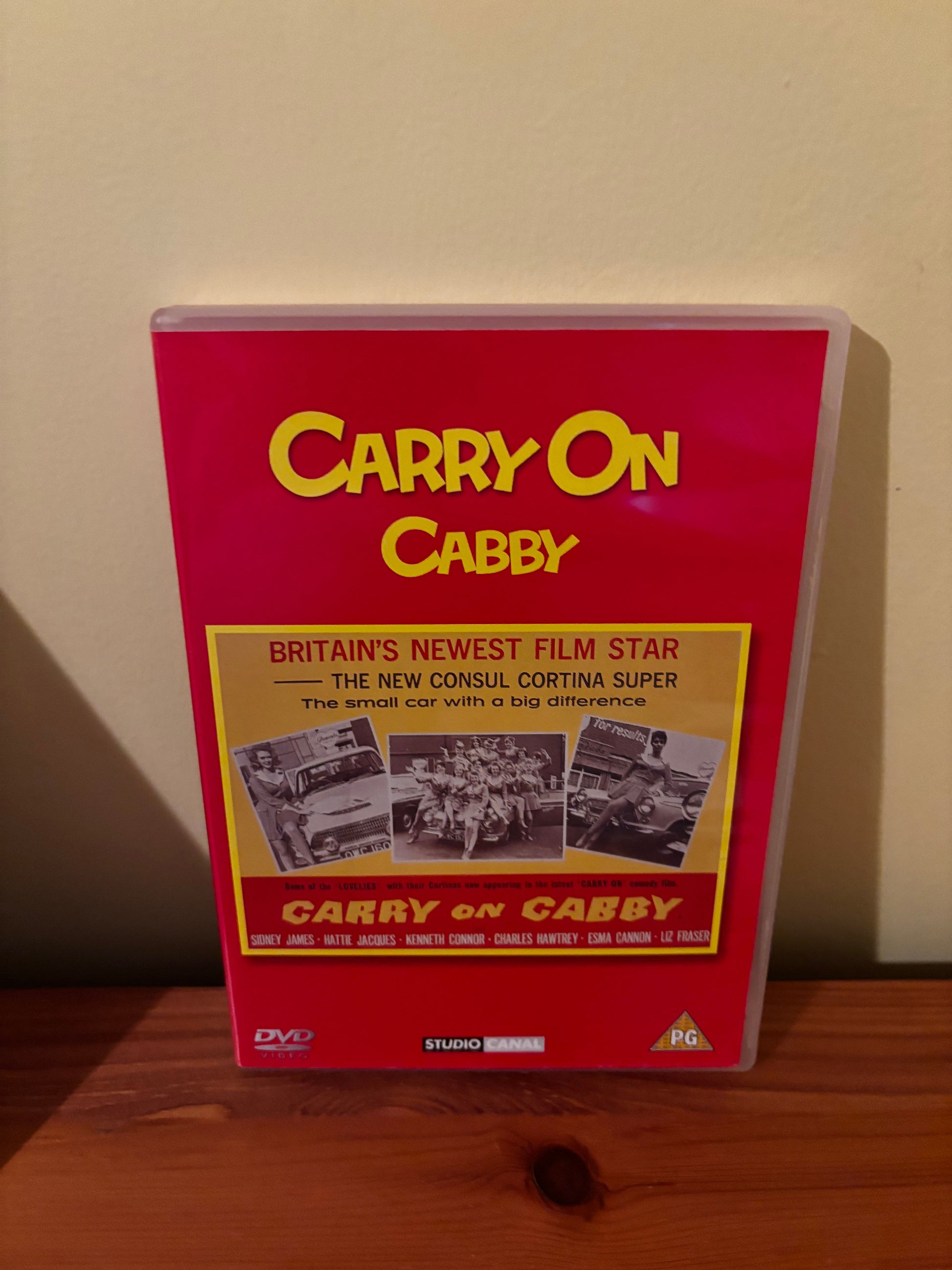 Carry On Films (Various) Please Choose From Dropdown showcases classic British comedy on this vibrant DVD cover.