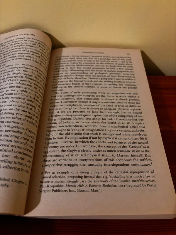 Opened pages of The Origin of Species (Classics of World Literature), a timeless exploration of evolution by Charles Darwin.