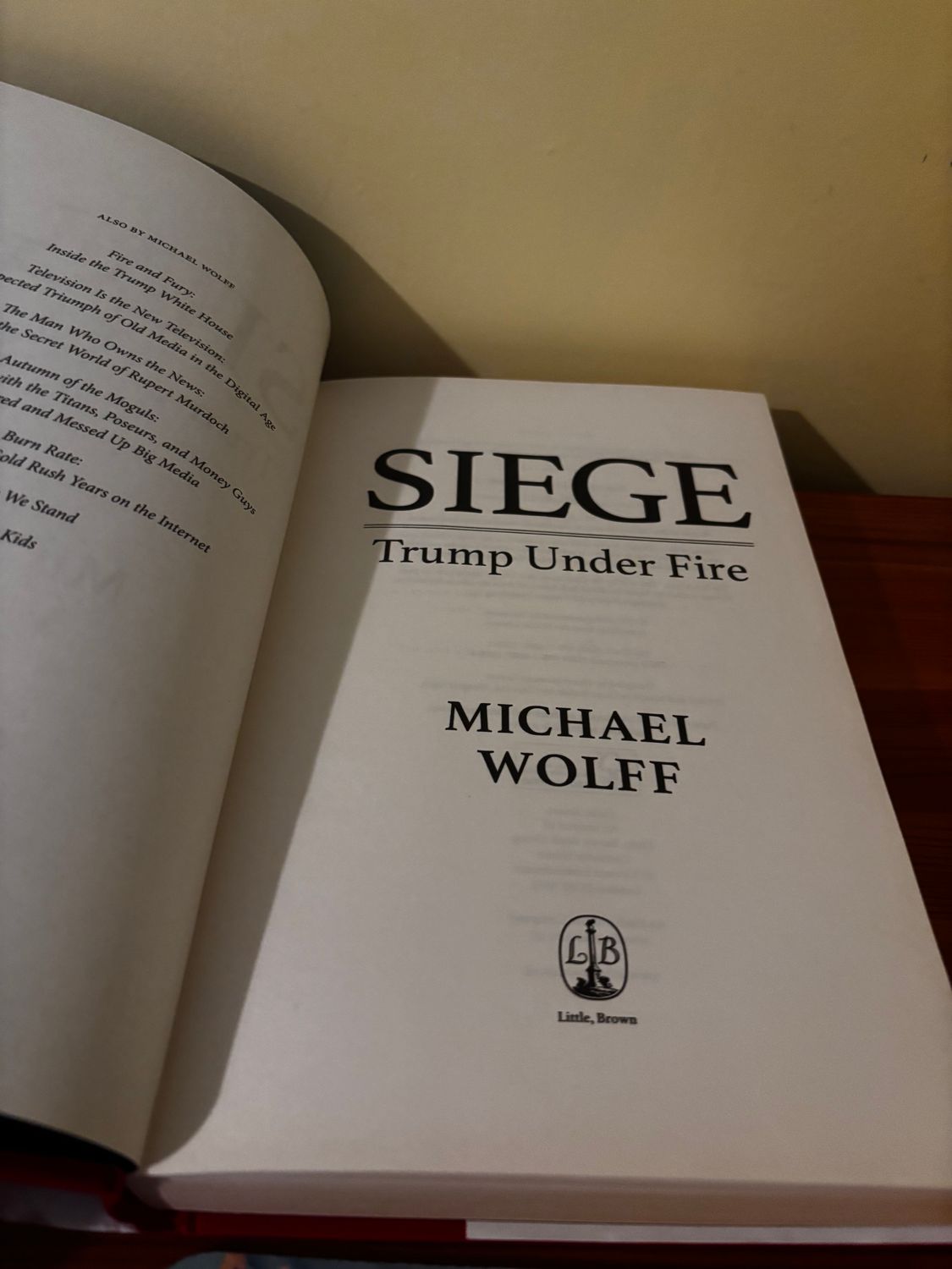 Explore the complexities of politics with Siege: Trump Under Fire Hardcover by Michael Wolff, now available preloved.