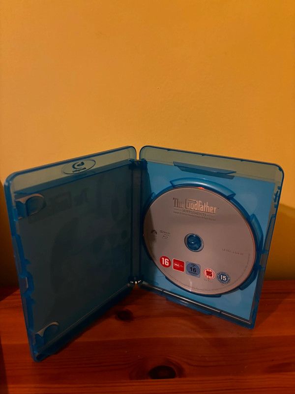 The Godfather Coppola Restoration [Blu-ray] [1972] [Region Free] in a blue case, perfect for any collector's shelf.