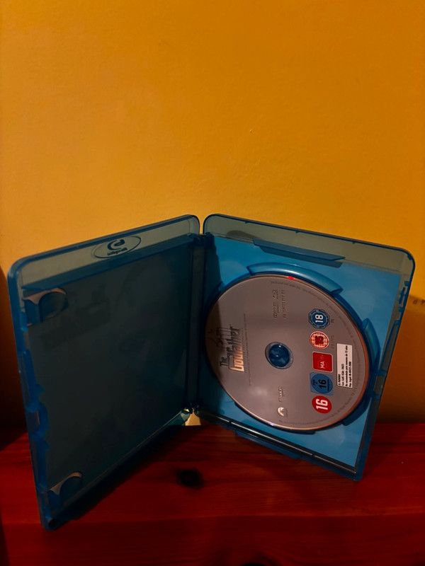 The Godfather Coppola Restoration [Blu-ray] [1972] [Region Free] displayed in its collector's case, perfect for fans.
