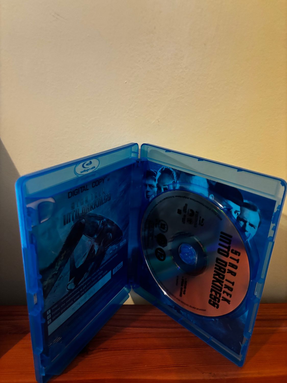 Star Trek Into Darkness (Blu-ray) [Region Free] in a blue case, perfect for sci-fi fans at your favourite store.