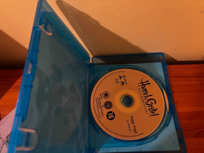 Hansel and Gretel: Witch Hunters 2013 Blu-ray displayed in its case, featuring a thrilling reimagining of the classic tale.