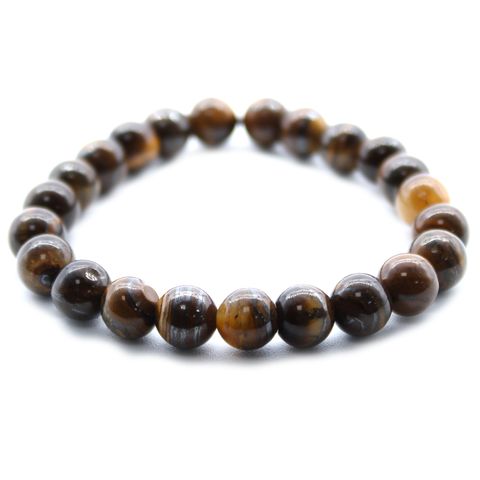 Elegant Power Bracelet - Tiger Eye showcasing natural stone beauty, perfect for any outfit and promoting harmony.