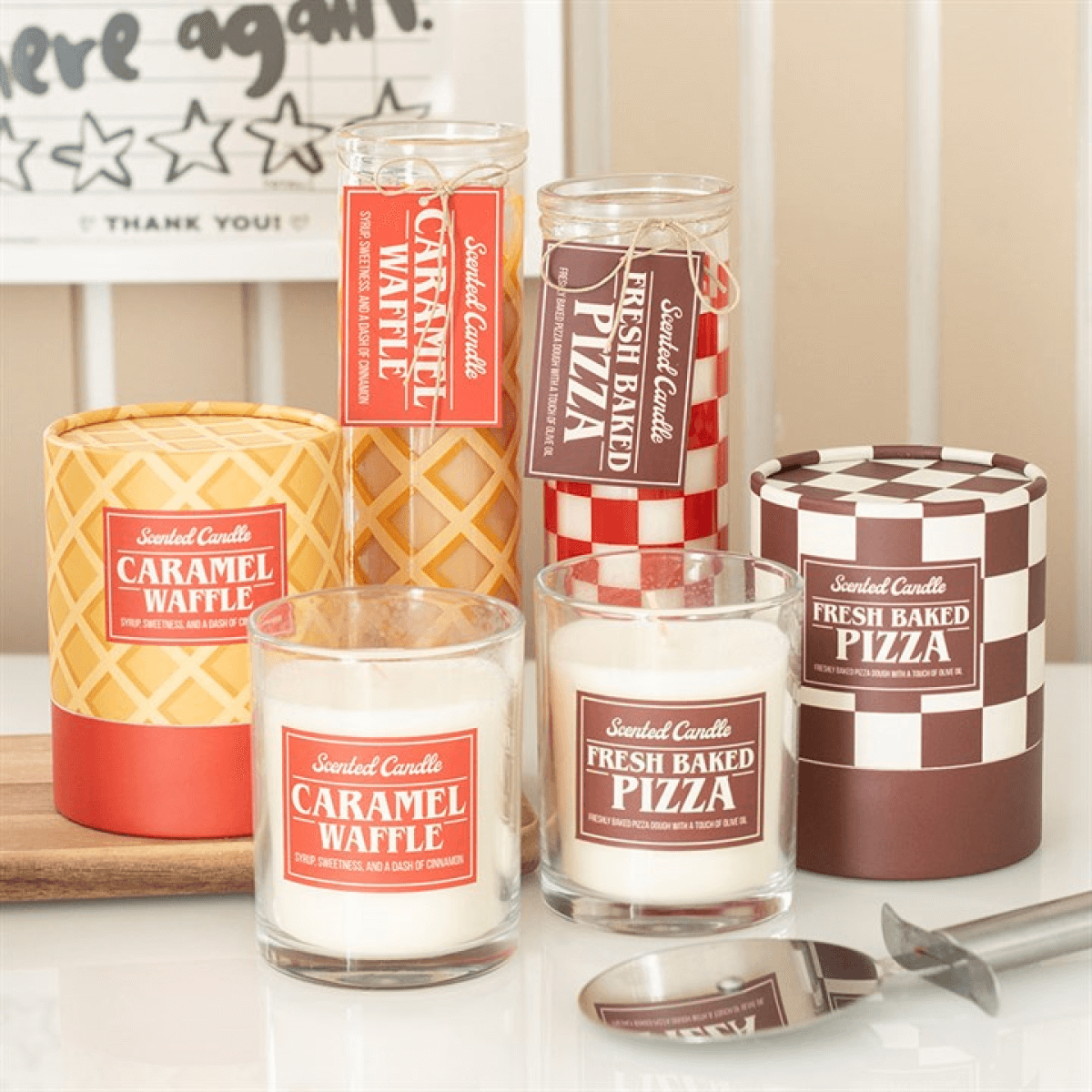 Caramel Waffle Scented Tube Candle 55 Hours Burn Time displayed with Fresh Baked Pizza candles in a cozy setting.