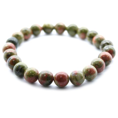 Power Bracelet - Green Jasper features vibrant beads, perfect for any outfit while absorbing negative energy.