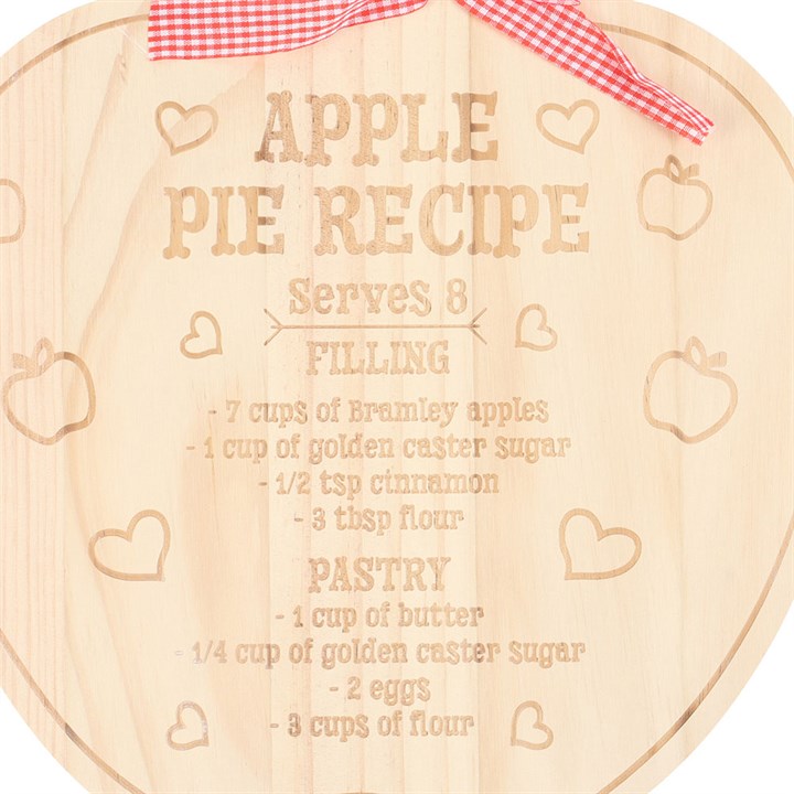 Apple Pie Recipe Serving Board: round wooden board with engraved recipe, hearts, apples and a red ribbon.