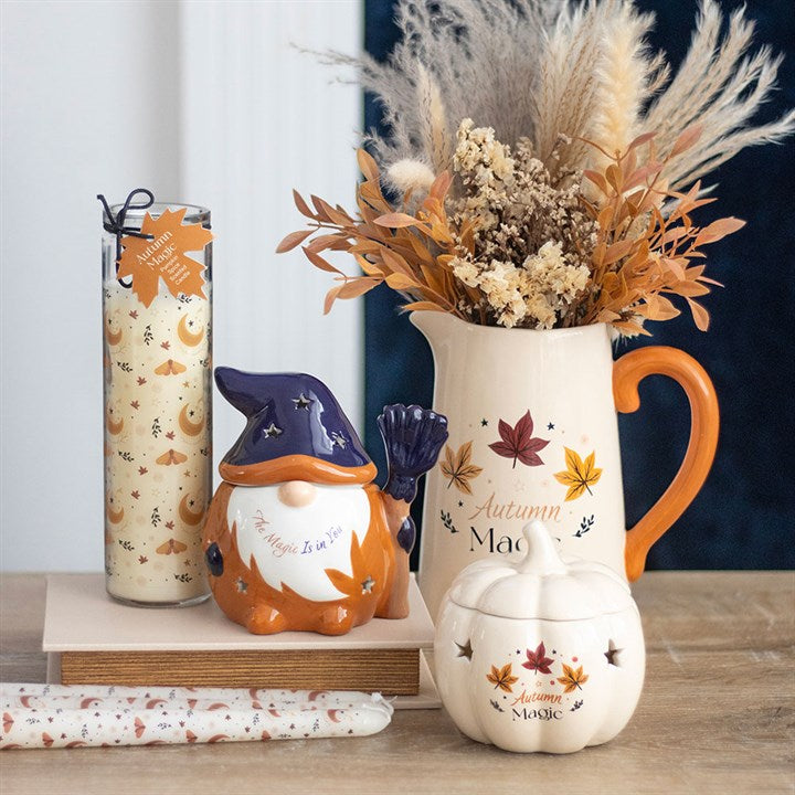 Charming Autumn Magic Pumpkin Oil Burner alongside autumn decorations, perfect for creating seasonal ambience.