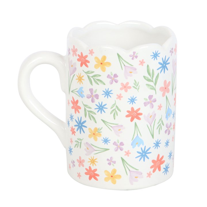 Delight in the Spring Floral Print Scalloped Mug, featuring blooming flowers in pastel hues, perfect for your morning coffee.