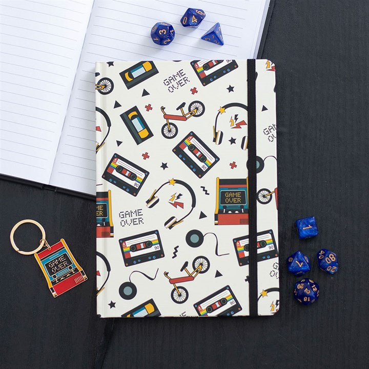 Retro 80s Print A5 Notebook features nostalgic designs of cassette tapes, bikes, and game controllers for creative notes.