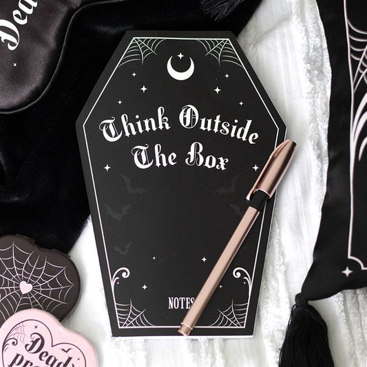 Coffin Shaped Notebook features a sleek black cover with pink accents, perfect for stylish note-taking and journaling.