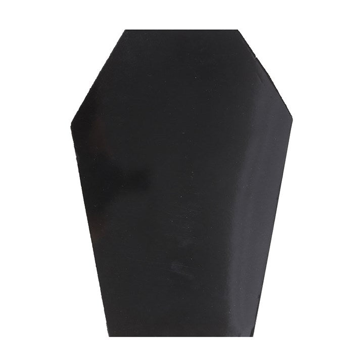 Coffin shaped notebook with sleek black cover and pink accents, perfect for stylish journaling and doodling.