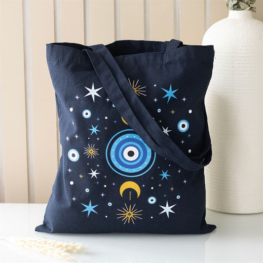 Dark blue All Seeing Eye Polycotton Tote Bag with celestial designs, perfect for errands and spiritual vibes.