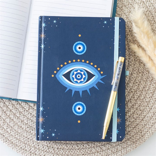 All Seeing Eye A5 Notebook with Crystal Chip Pen, featuring a dark blue design and gold-tone pen for mystical writing.