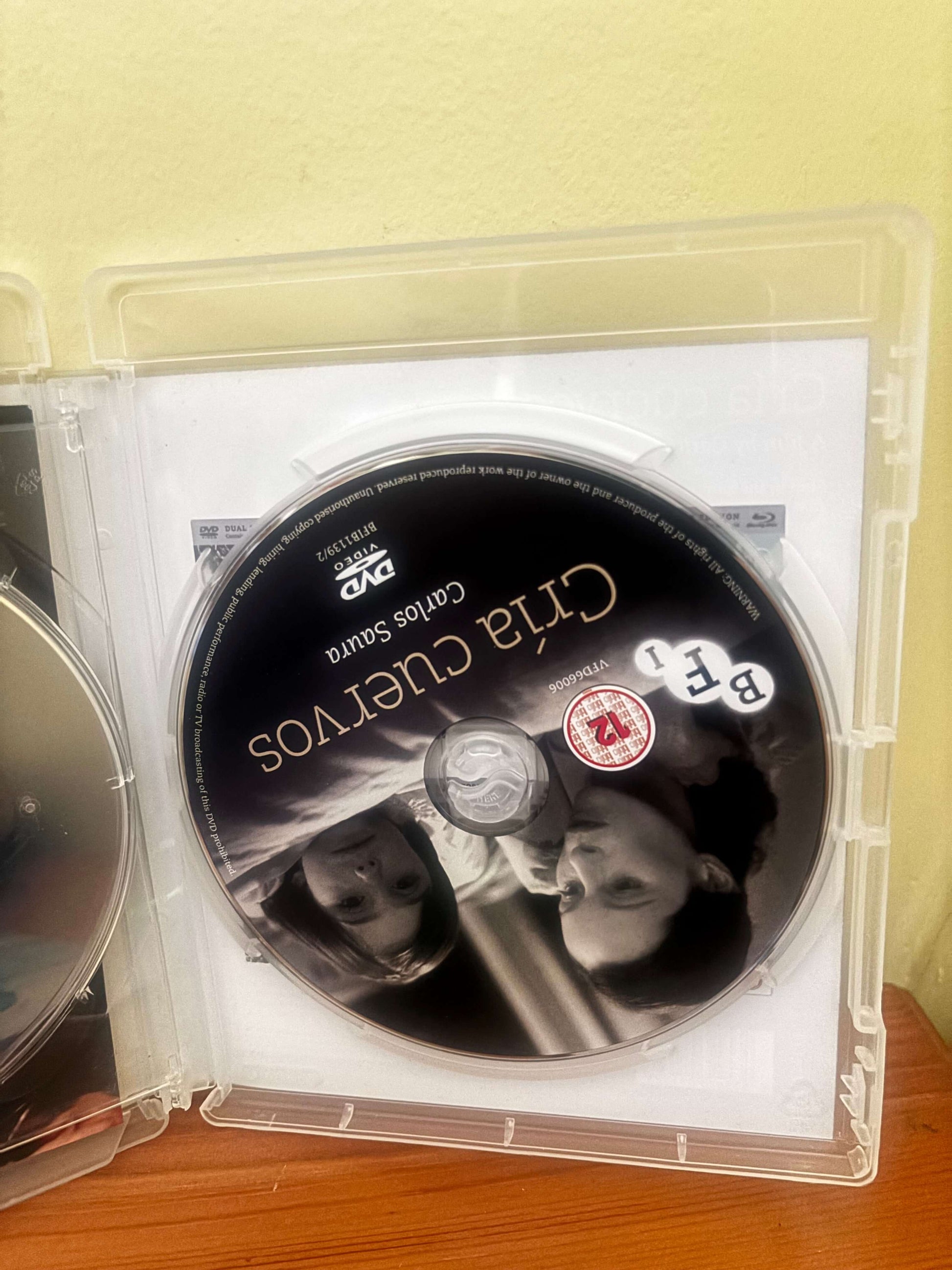DVD disc with a couple on the cover, placed in a clear plastic case.