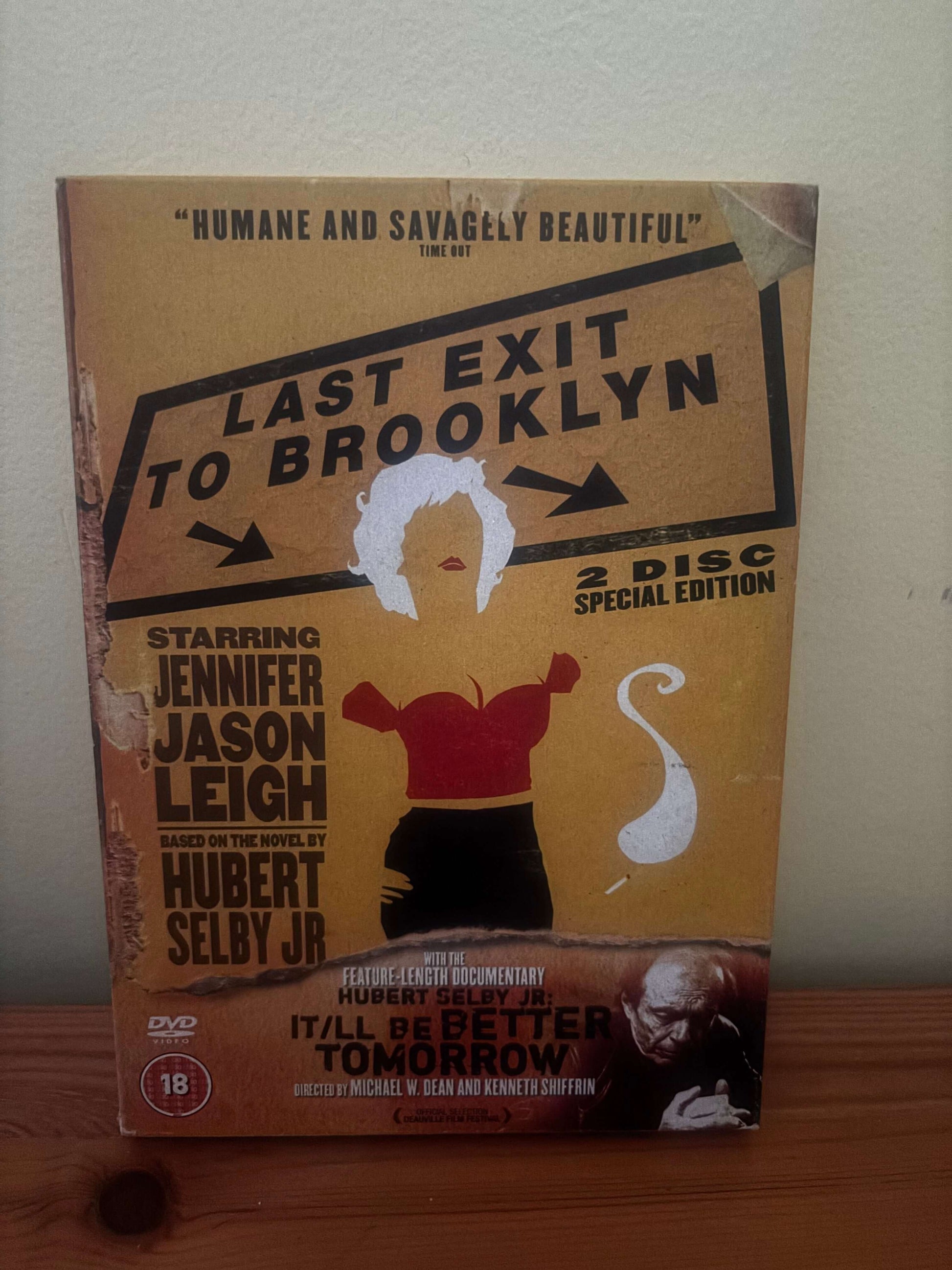 DVD cover of 'Last Exit to Brooklyn' with a stylized illustration on a beige background.