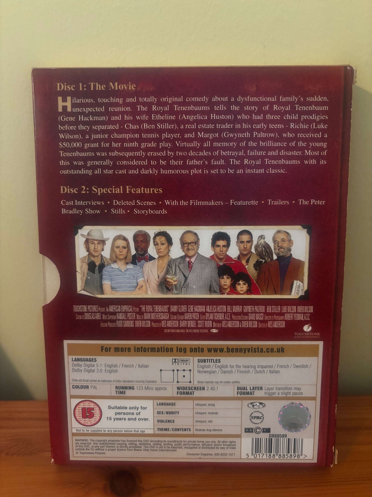 DVD case with movie cover and text on a wooden surface