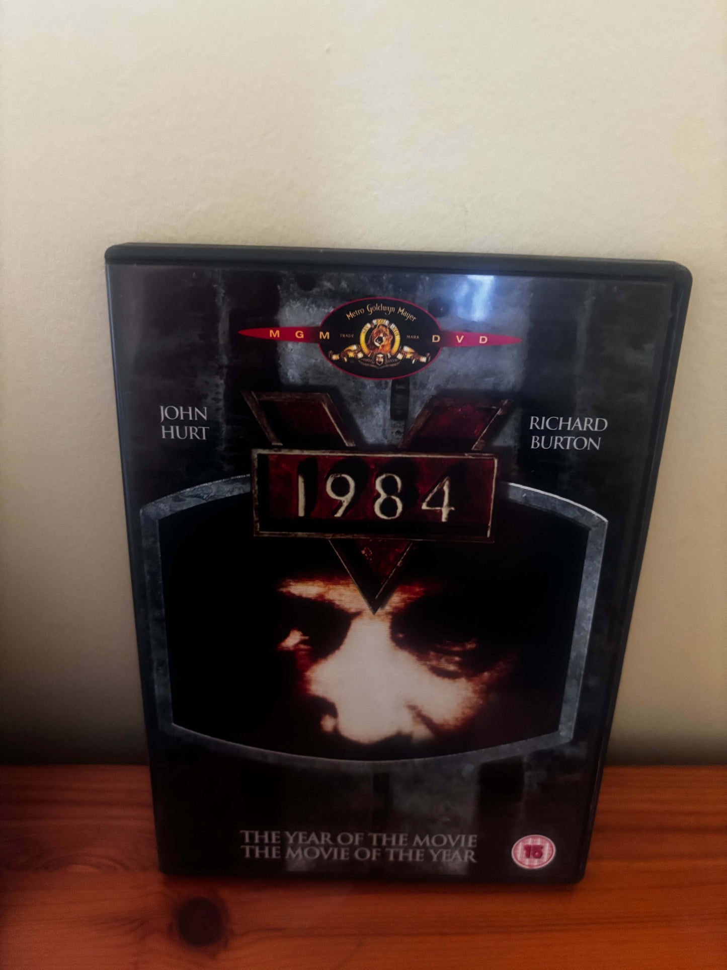 DVD cover of '1984' with a dark background and text