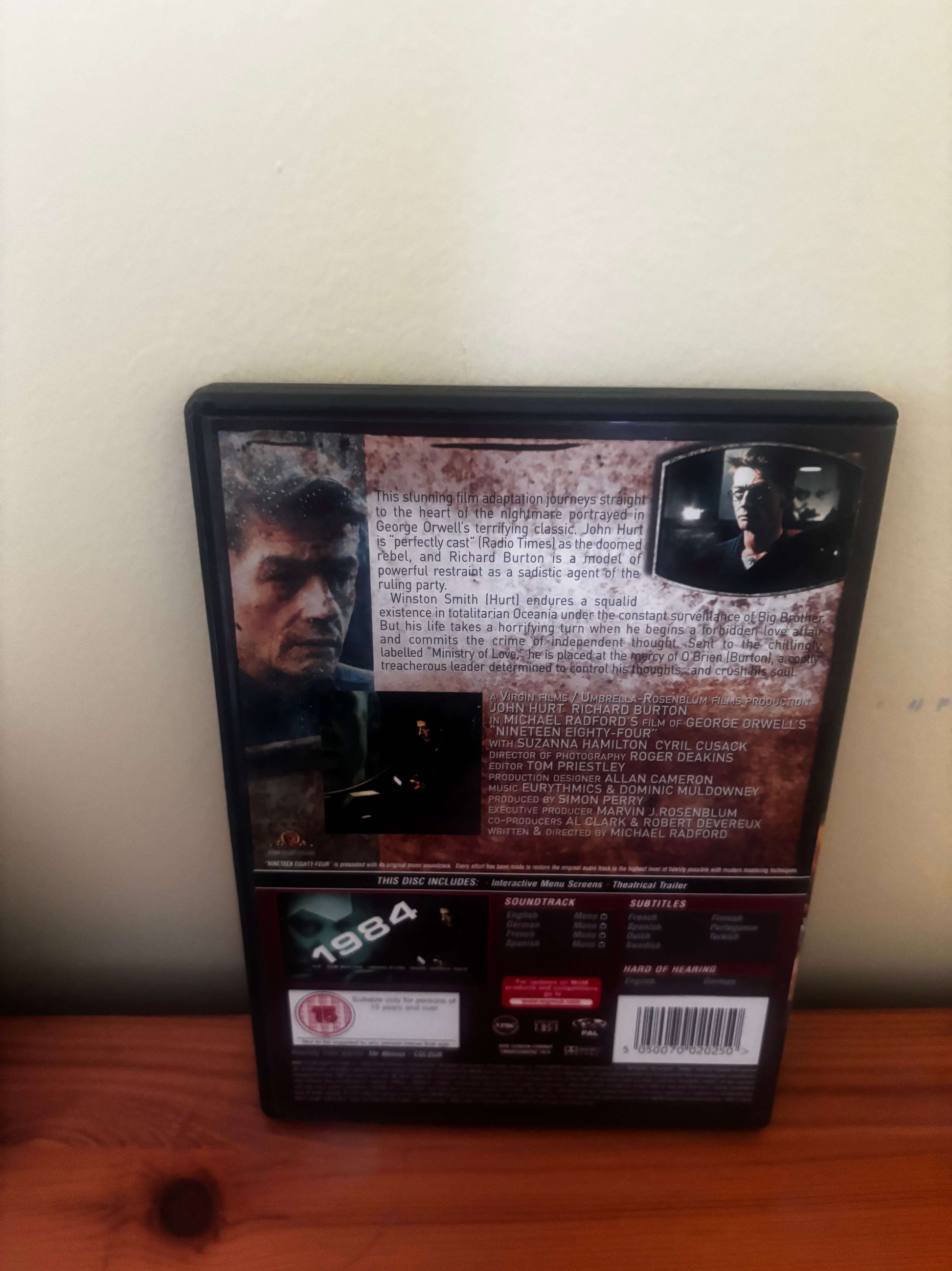 DVD case with movie cover on a wooden surface
