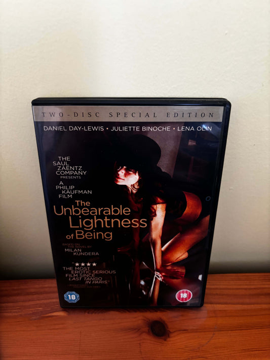 DVD cover of 'The Unbearable Lightness of Being' on a wooden surface.