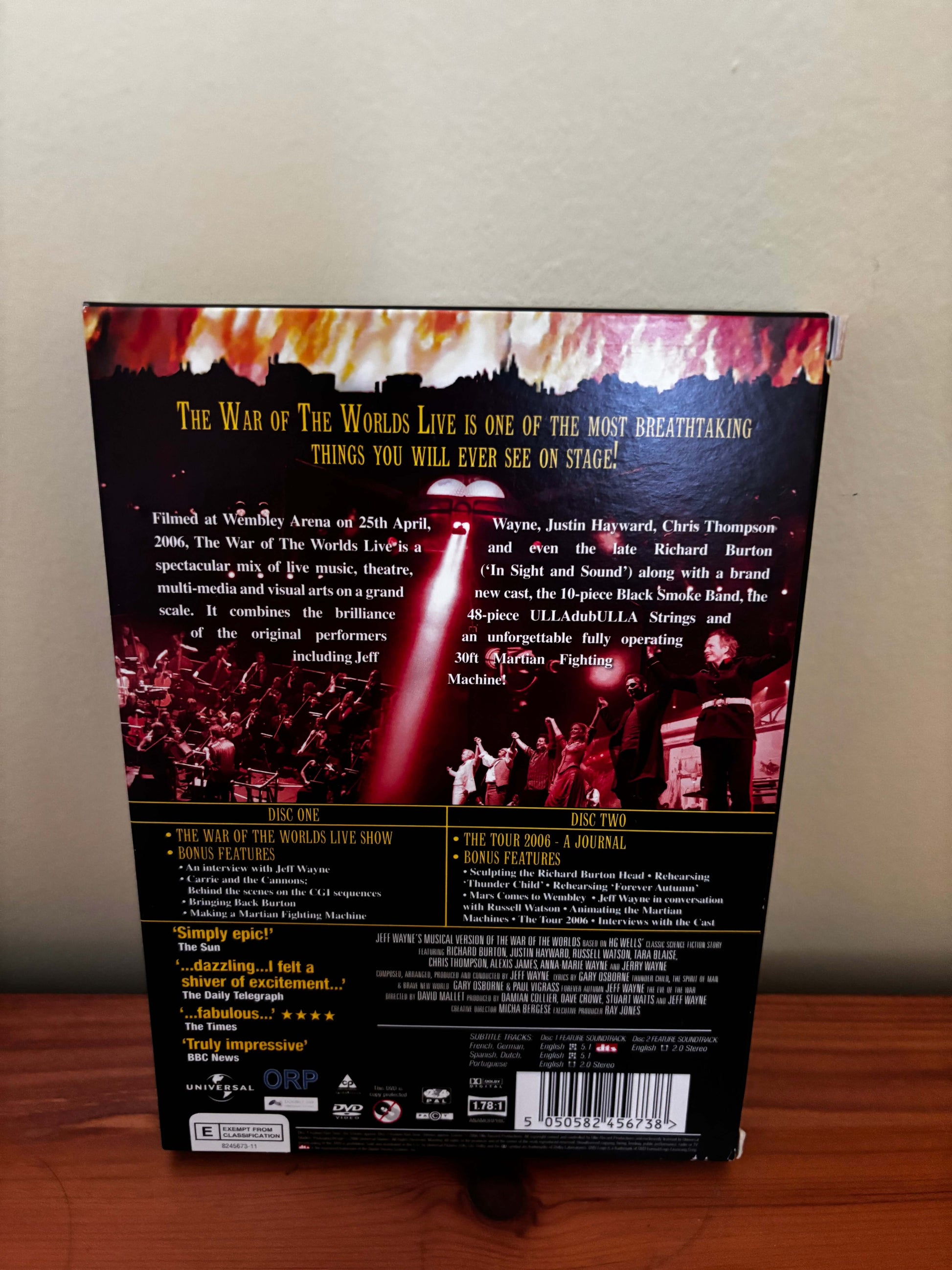 Back cover of a DVD or Blu-ray disc with text and images on a plain background