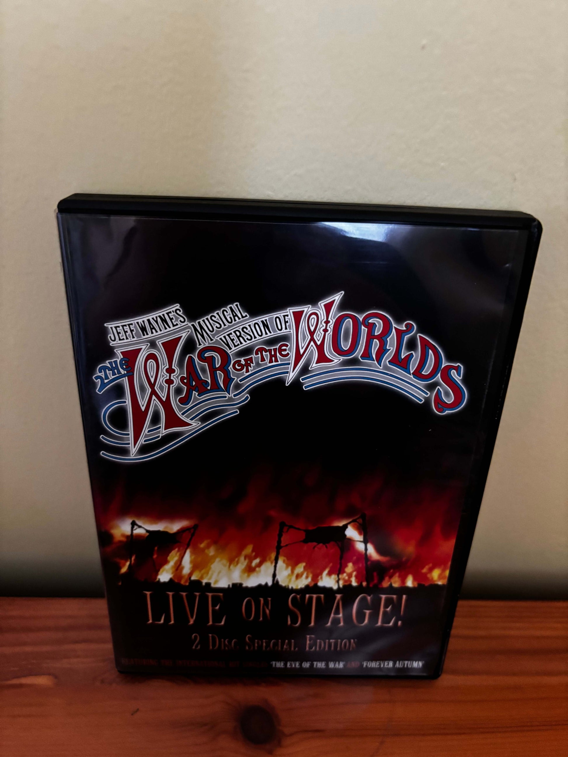 DVD cover of 'War of the Worlds' musical version on stage
