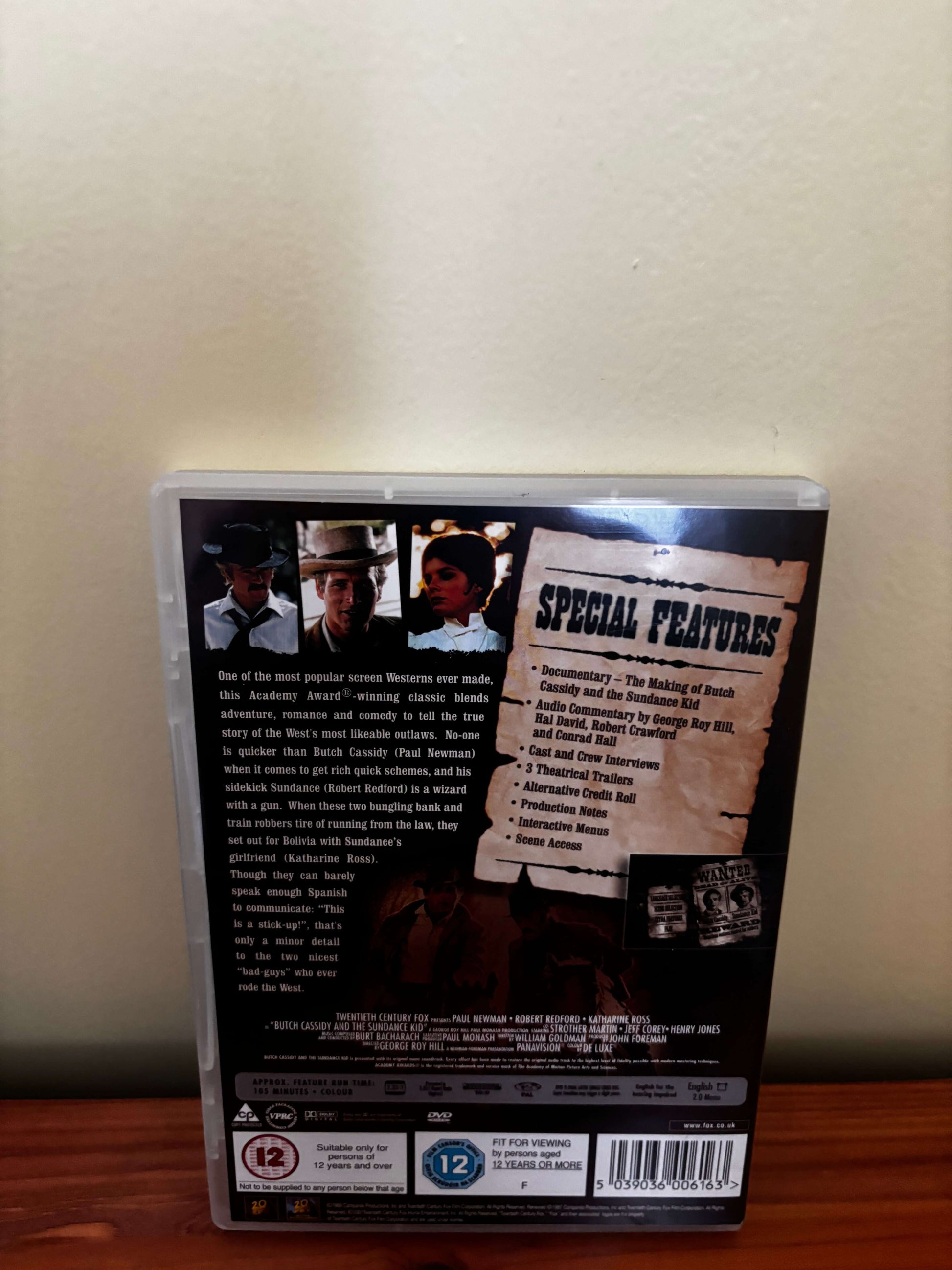 Back cover of a DVD with special features listed on a beige background